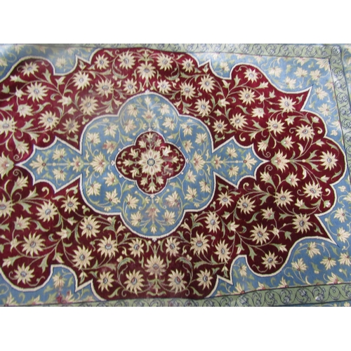 1573 - A small silk Persian rug with an all over floral pattern, signed lower centre, 114cm x 78cm.