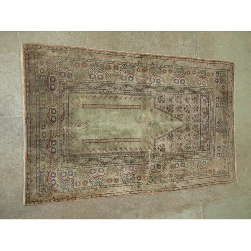 1576 - An old Middle Eastern prayer mat in pale green floral patterns, 135cm x 84cm