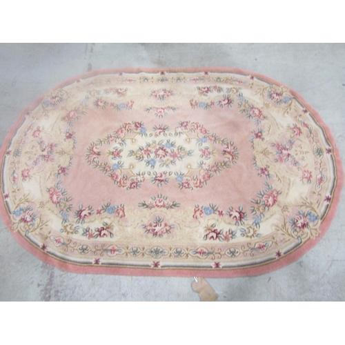 1580 - A vintage wool floral needlepoint embroided oval rug, 180cm 120cm.