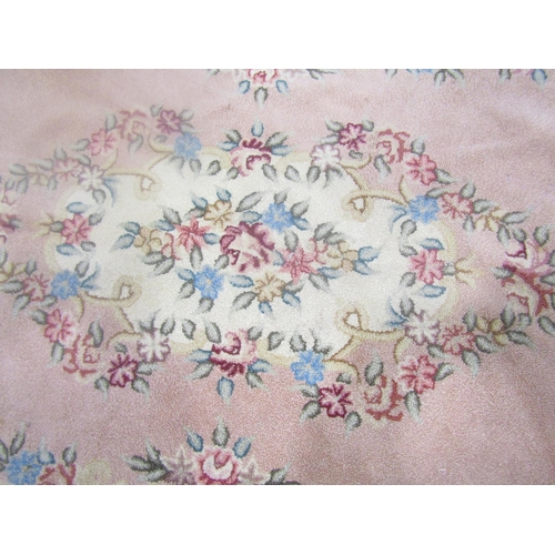 1580 - A vintage wool floral needlepoint embroided oval rug, 180cm 120cm.