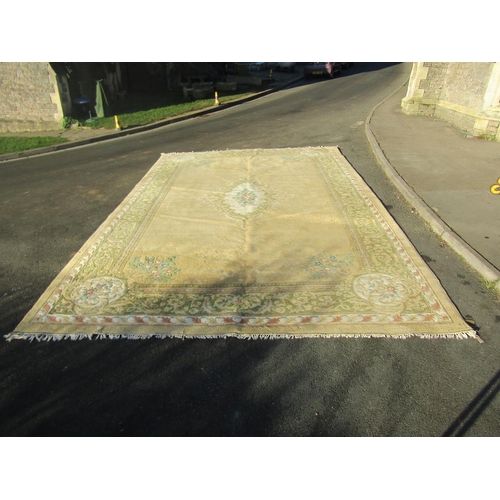 1594 - A Chinese wool carpet of Aubusson design, with a central floral medallion on cream ground, 518cm x 3... 