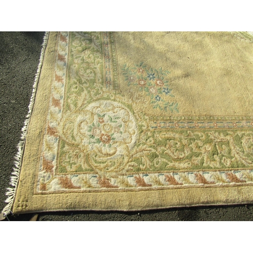 1594 - A Chinese wool carpet of Aubusson design, with a central floral medallion on cream ground, 518cm x 3... 