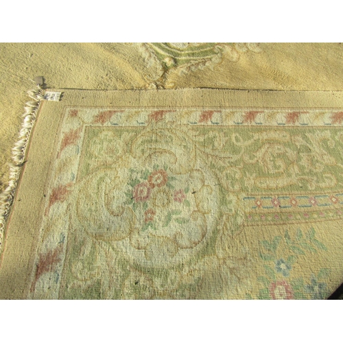 1594 - A Chinese wool carpet of Aubusson design, with a central floral medallion on cream ground, 518cm x 3... 