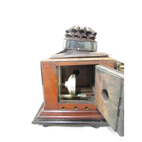 536A - A Victorian Triumph Magic Lantern slide projector on a mahogany plinth.