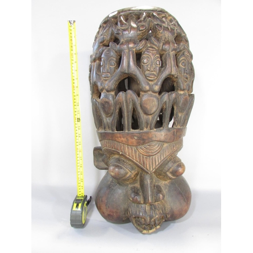 643 - A Bamileke Helmet Mask from Cameroon, carved hardwood, 90cm x 35cm approx