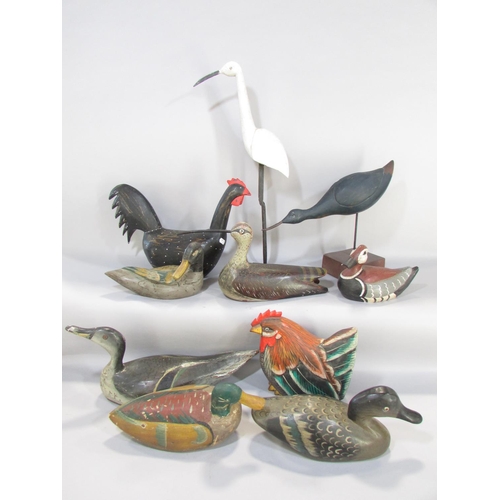 644 - A collection of hand painted wooden decoy ducks, chickens, waders etc