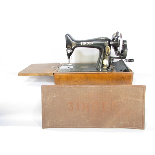 645 - A Singer sewing machine, manually operated, No EK417262, in its original faux crocodile hard case an... 