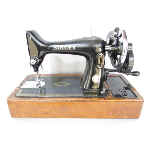 645 - A Singer sewing machine, manually operated, No EK417262, in its original faux crocodile hard case an... 