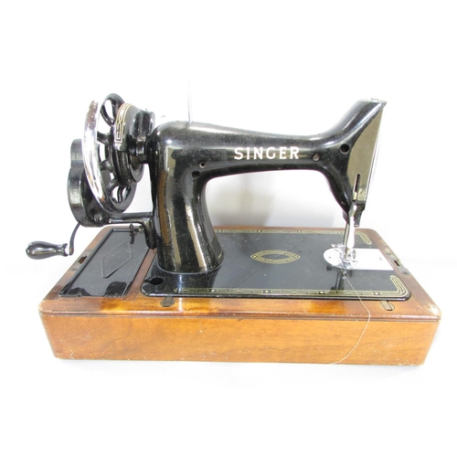 645 - A Singer sewing machine, manually operated, No EK417262, in its original faux crocodile hard case an... 