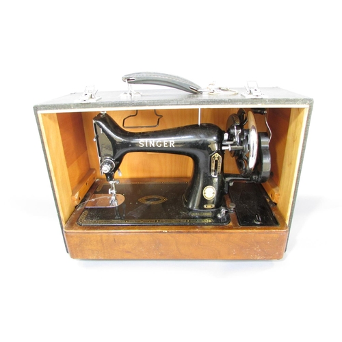 645 - A Singer sewing machine, manually operated, No EK417262, in its original faux crocodile hard case an... 