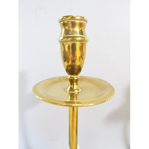 648C - A pair of 19th century brass candlesticks with slender column supports