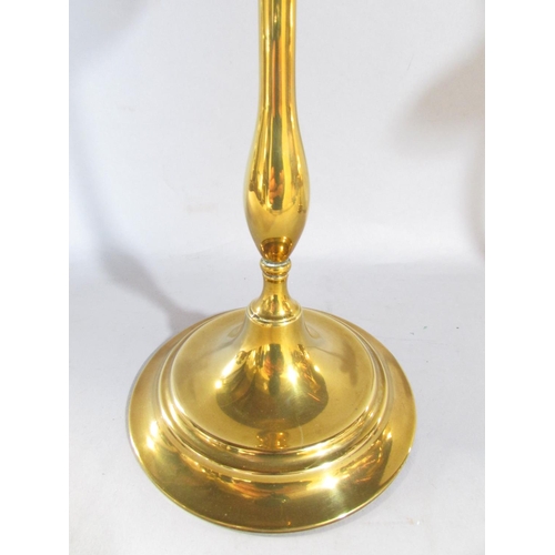 648C - A pair of 19th century brass candlesticks with slender column supports