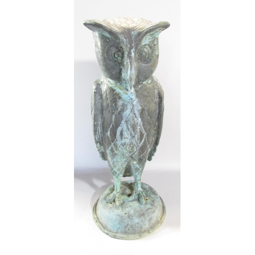 649A - A copper wise old owl with eyebrows, in a weathered verdigris finish, raised on a domed dais, 43cm h... 