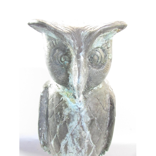 649A - A copper wise old owl with eyebrows, in a weathered verdigris finish, raised on a domed dais, 43cm h... 