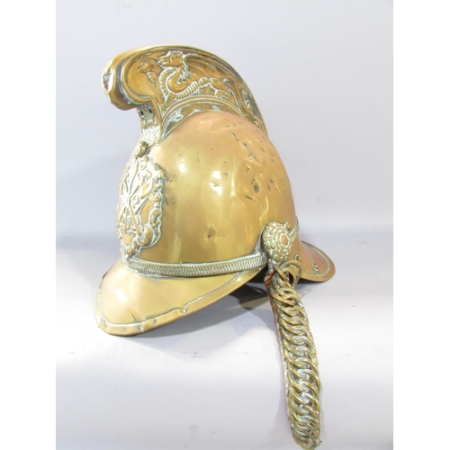 650 - Brass Merryweather pattern fireman's helmet with high comb, dragon embossed detail, standard firebri... 