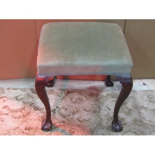 1212 - A small Georgian style mahogany upholstered stool raised on claw and ball supports, together with a ... 