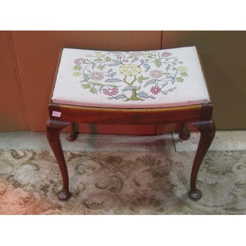 1212 - A small Georgian style mahogany upholstered stool raised on claw and ball supports, together with a ... 