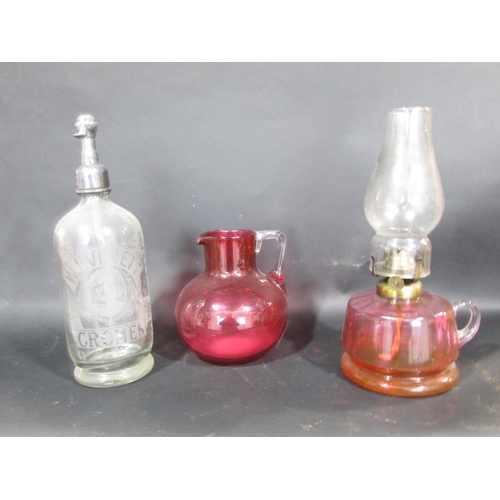 536 - A miscellaneous collection of items including some wooden fruit, a W. Everett Cromer Soda Siphon, a ... 