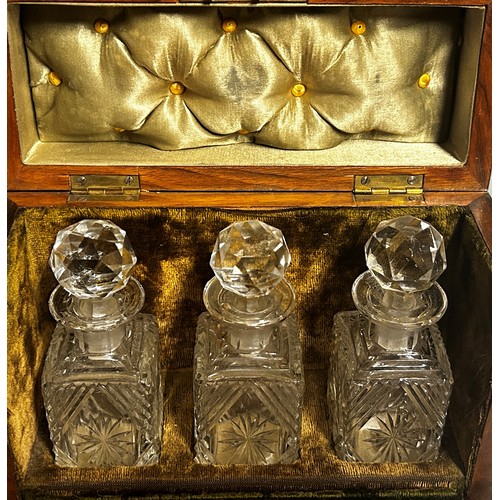 193 - A small 19th century satinwood velvet lined travelling decanter set with three cut glass decanters b... 