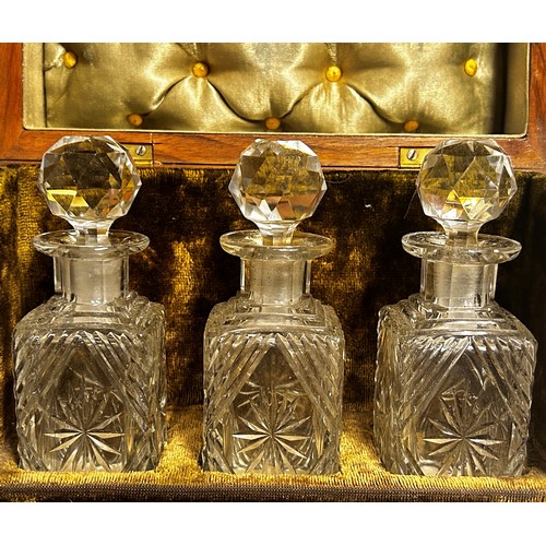 193 - A small 19th century satinwood velvet lined travelling decanter set with three cut glass decanters b... 