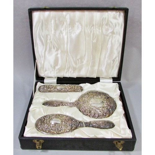 232 - An early 20th century silk lined box with a silver hair brush set, a hand mirror, hair and clothes b... 