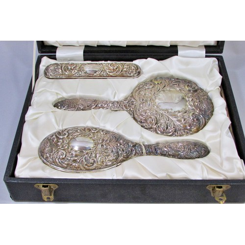 232 - An early 20th century silk lined box with a silver hair brush set, a hand mirror, hair and clothes b... 