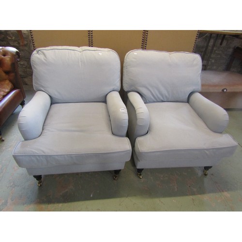 1275 - A pair of Sofa workshop contemporary Howard style easy chairs with pale blue upholstery and loose cu... 