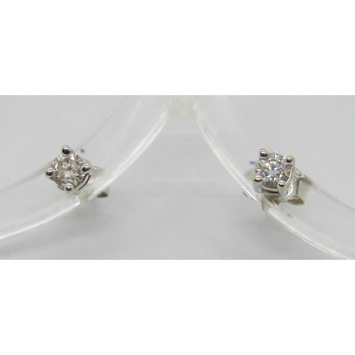 421 - 18ct diamond solitaire ring, size L/M, 2.7g and a pair of 18ct white gold diamond stud earrings, 0.9... 