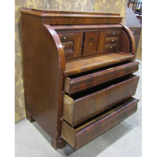 1211A - 19th century continental mahogany cylinder bureau, enclosing a fitted interior of drawers, pigeon ho... 