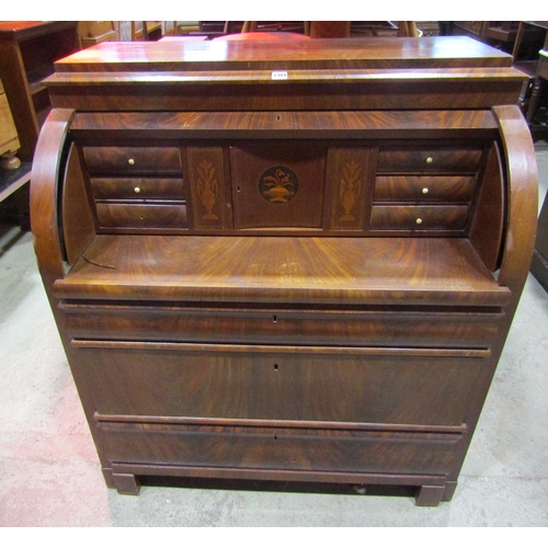 1211A - 19th century continental mahogany cylinder bureau, enclosing a fitted interior of drawers, pigeon ho... 