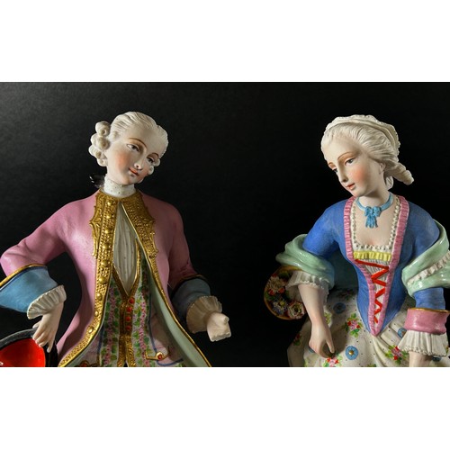 60 - A pair of 19th century German bisque figures of male and female characters in 18th century dress, ra... 