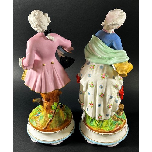 60 - A pair of 19th century German bisque figures of male and female characters in 18th century dress, ra... 