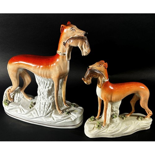 62 - A collection of 19th century and later Staffordshire hounds, greyhounds, Dalmatians, etc, together w... 