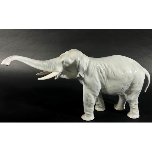 70 - Three Royal Copenhagen porcelain figures to include an elephant, a deer and a boy (3)