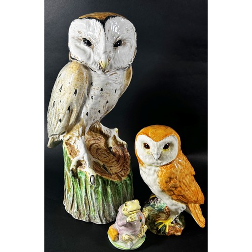 72 - An Italian pottery of a barn owl upon a stump (life sized) together with a Beswick owl and figure of... 