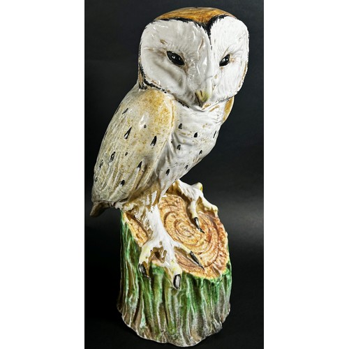 72 - An Italian pottery of a barn owl upon a stump (life sized) together with a Beswick owl and figure of... 