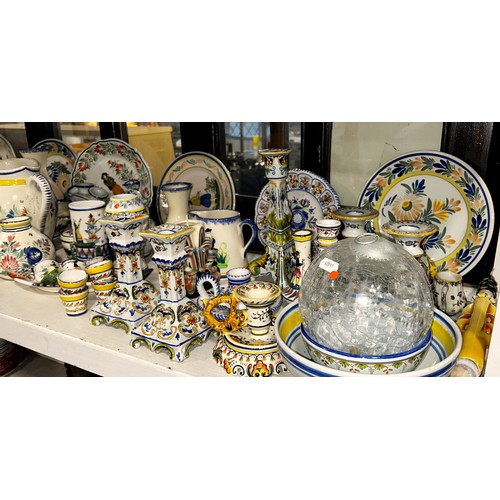 98 - A large quantity of Quimper Faience to include plates, vases, candlesticks, jugs etc