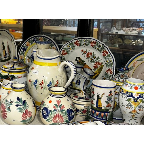 98 - A large quantity of Quimper Faience to include plates, vases, candlesticks, jugs etc