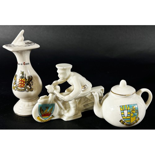 112 - Six crested china items to include a military cap with Berkeley and Gloucester Canal and Sharpness m... 