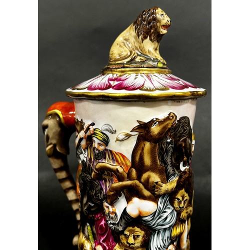 56 - A Capodimonte porcelain tankard, decorated with battle scene, the handle formed from an elephants he... 