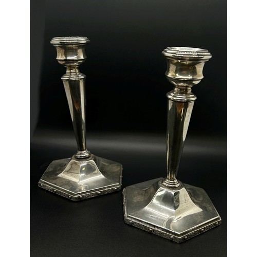 177 - A pair of students silver sprung candlesticks, Birmingham 1903, makers mark rubbed, together with a ... 