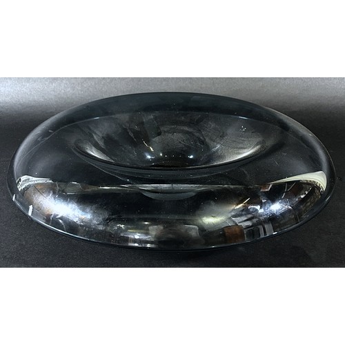 121 - A Schott Zwiesel smoked glass shallow bowl with a rounded downturned rim, maker’s stamp to base, 38c... 