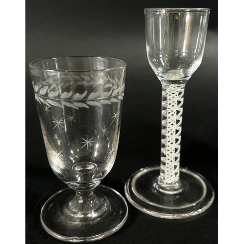 127 - A Georgian cordial glass with a bell shaped bowl raised on a double helix stem, together with four f... 