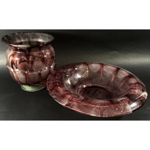 133 - An early 20th century purple “marble” glass bowl and vase, 35cm wide and 20cm high respectively.