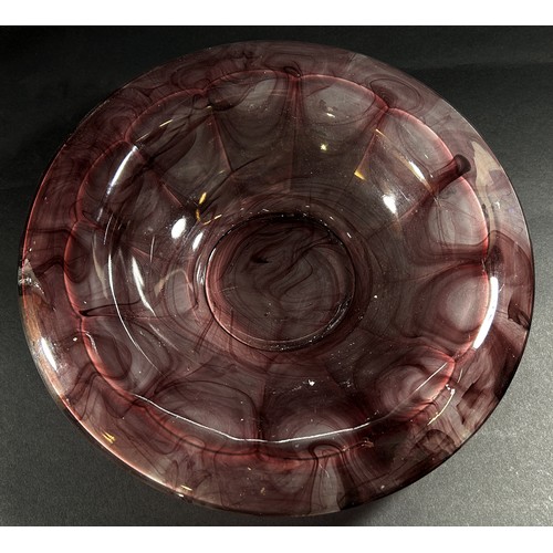 133 - An early 20th century purple “marble” glass bowl and vase, 35cm wide and 20cm high respectively.