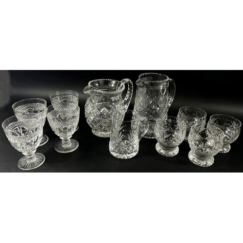 145 - A mixed selection of cut glass table ware including, Brandy glasses, wines, rounded tumblers, three ... 