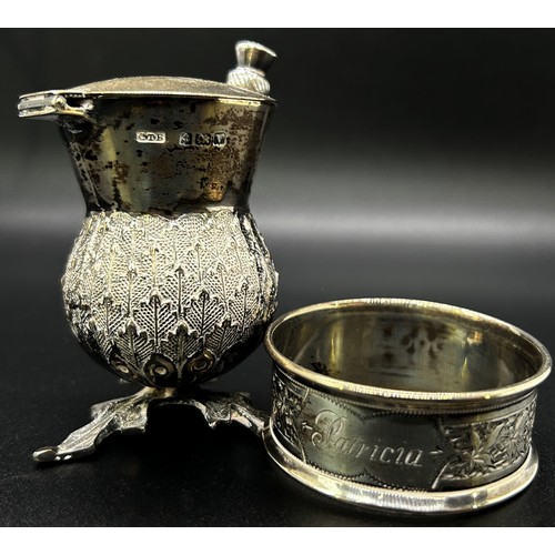 201 - A quantity of silver including a hand mirror, napkin ring, two souvenir spoons, thistle salt pot and... 