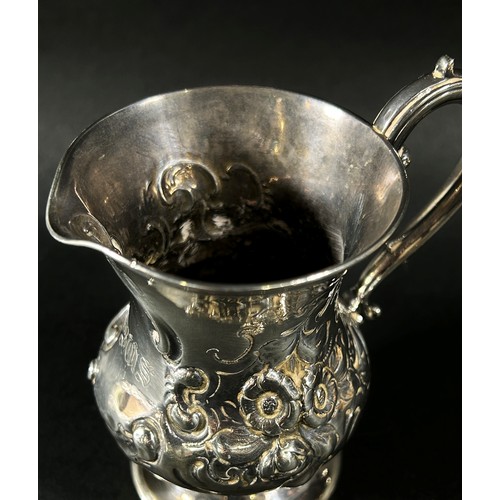 192 - A heavily engraved Victorian silver milk jug, London 1872, makers Daniel & Charles Houle, 10cm high,... 