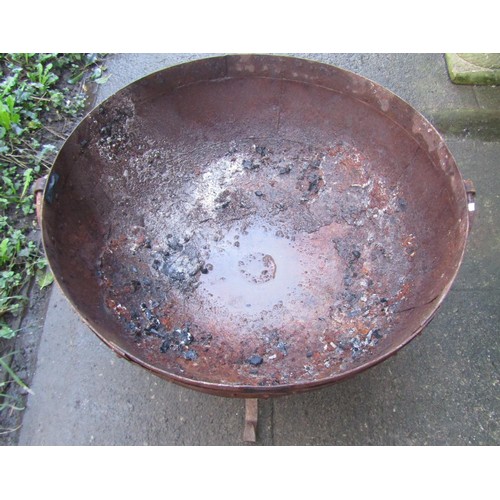 1016 - A weathered Kadai riveted iron fire pit and stand, 71cm diameter x 43cm high