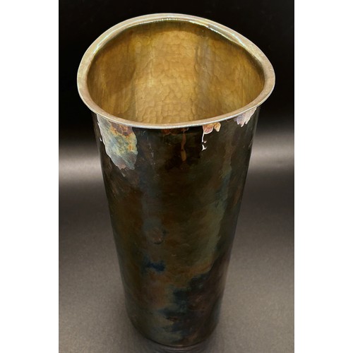 161 - A silver beaker with a hammered finish, stamped 830 handmade by Lofman, 19cm high.